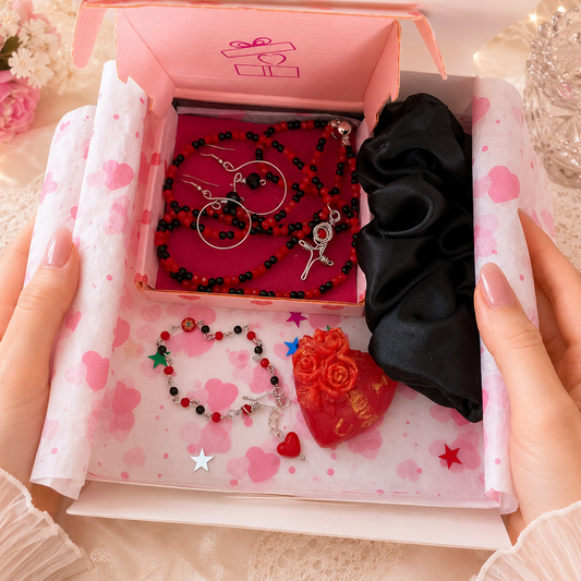 Set of jewelry including a necklace, earrings, bracelet, beeswax candle and a scrunchie inside gift box