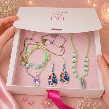 White gift box with necklace, earrings, bracelet and sun catcher.