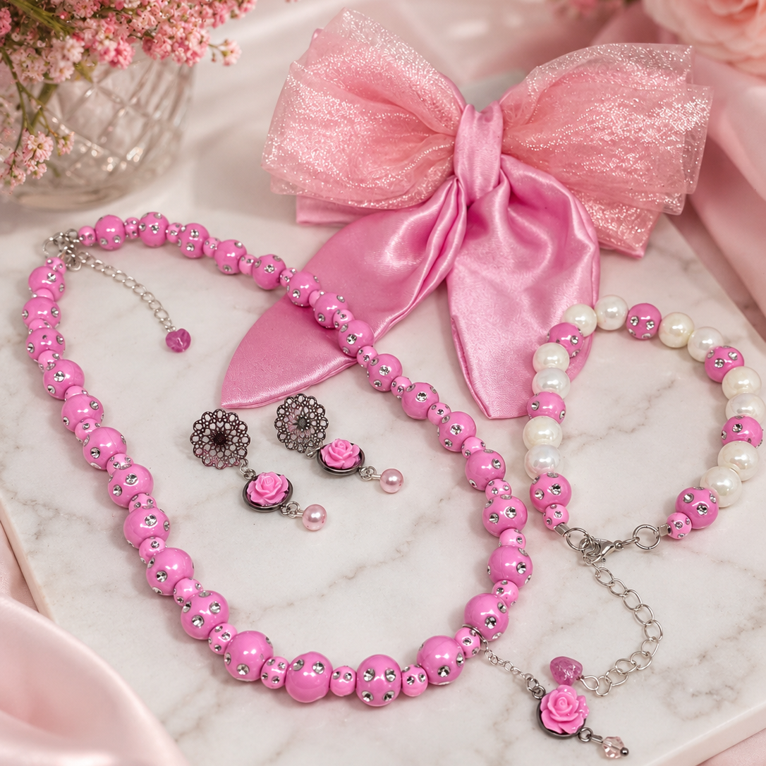 Pink beaded jewelry set,  pink satin bow, including a necklace, bracelet, earrings, and bracelet.