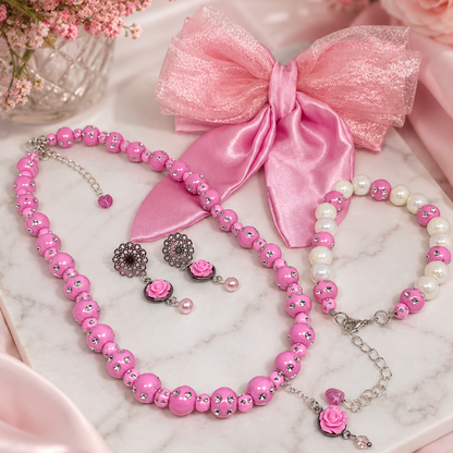 Pink beaded jewelry set,  pink satin bow, including a necklace, bracelet, earrings, and bracelet.