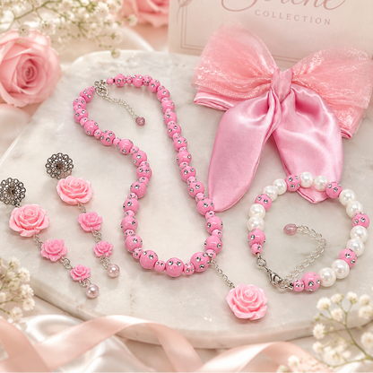 Gift set includes, pink beads necklace with rose pendant, rose dangling earrings, matching bracelet and pink satin, organza clip on hair bow.