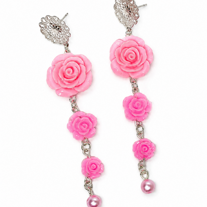 Pink rose-shaped earrings with silver accents