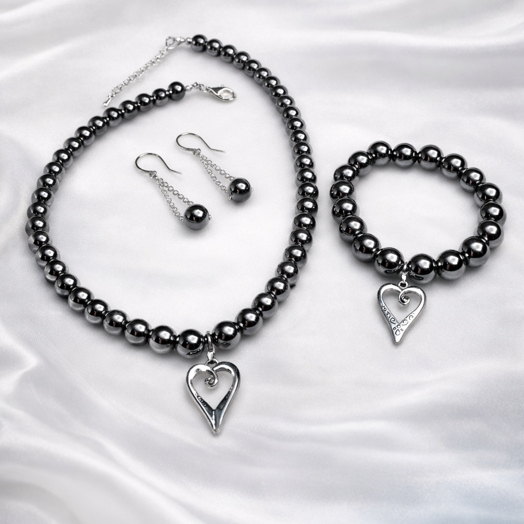 Chic Silver set for women featuring silver pearls necklace, matching bracelet and earrings inside organza gift bag.