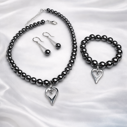 Chic Silver set for women featuring silver pearls necklace, matching bracelet and earrings inside organza gift bag.