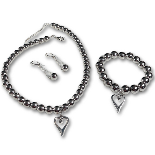 Chic Silver set for women featuring silver pearls necklace, matching bracelet and earrings inside organza gift bag.