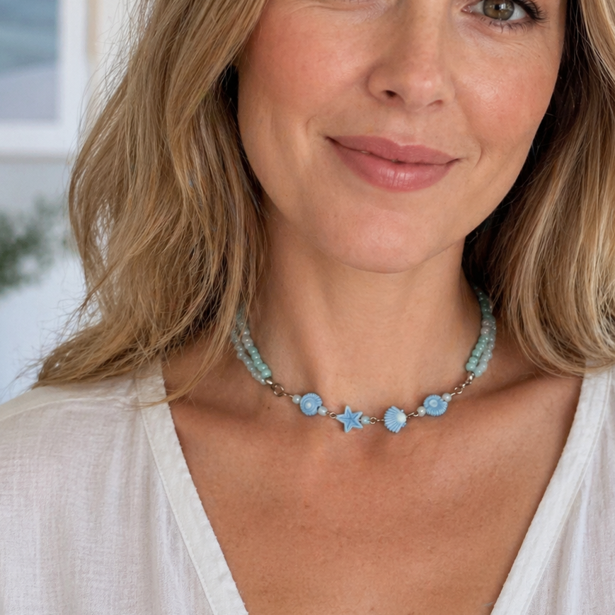Blue necklace with sea shell beads