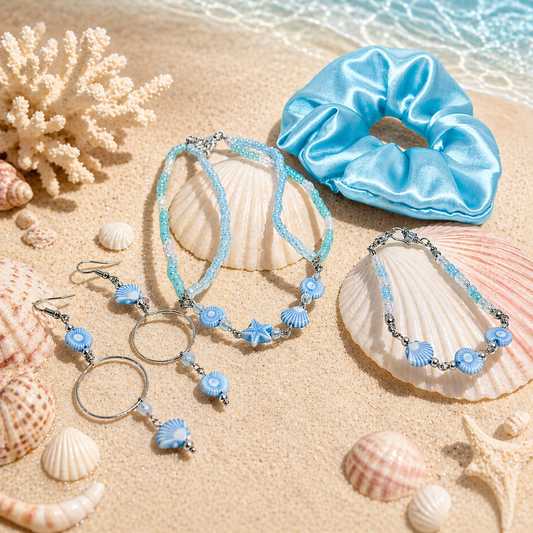 Blue jewelry set including necklace, earrings, bracelet and scrunchie.