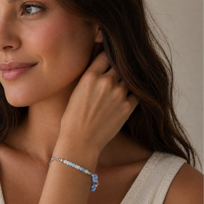 Light blue bracelet with sea shells beads.