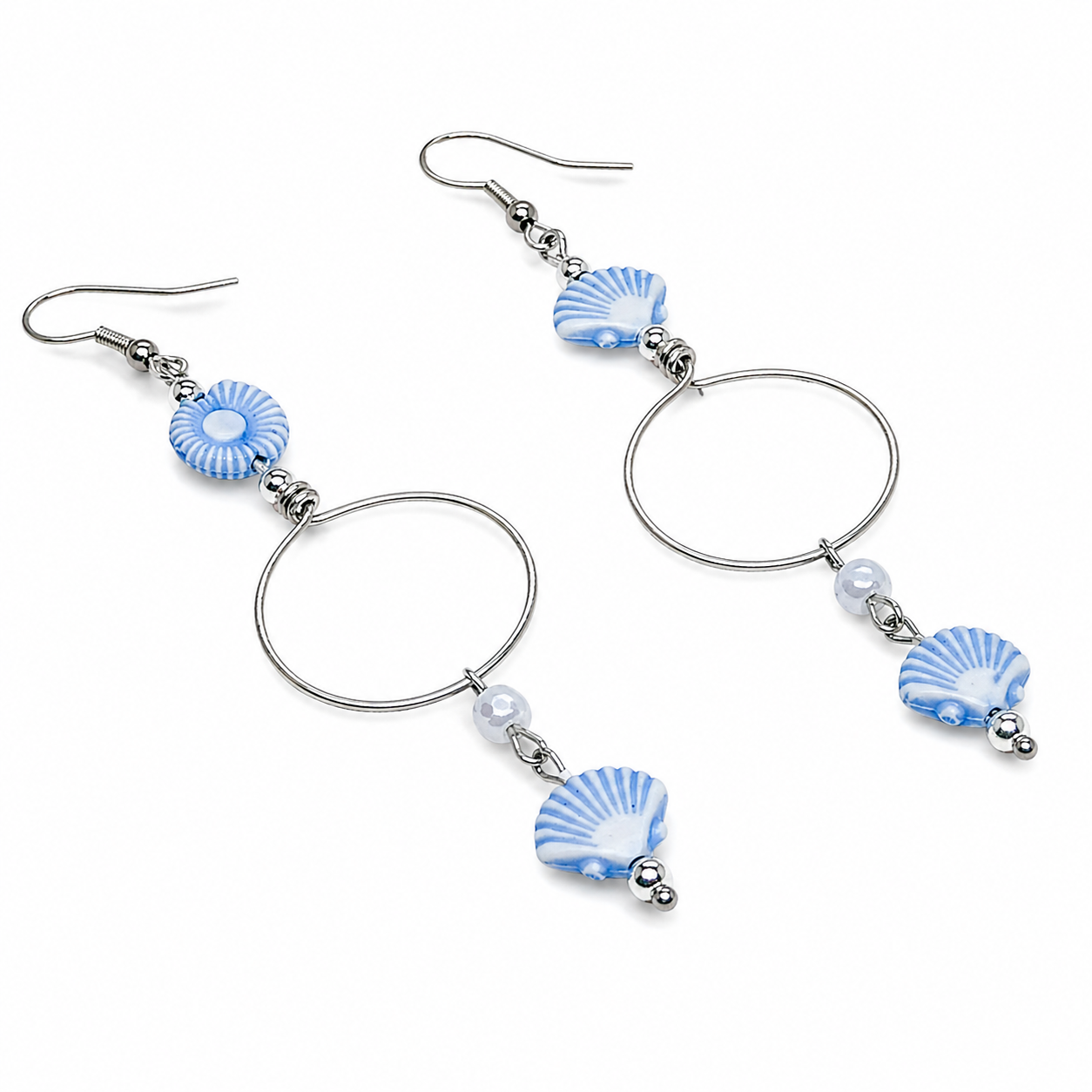 Pair of earrings with blue and white shell-like beads.