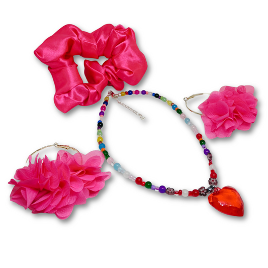 Gift Set consisting of  pink satin scrunchie, colorful beaded necklace with heart pendant, and pink floral earrings.