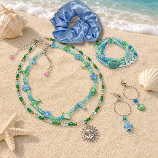 This gift set includes, blue satin hair scrunchie, three beach themed bracelets, two necklaces & earrings.