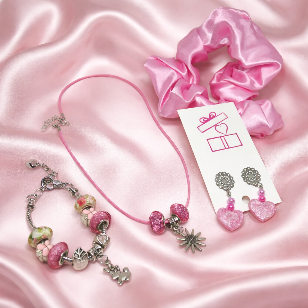 Gift set consists of necklace, matching charm bracelet, resin hearts earrings and pink satin hair scrunchie.