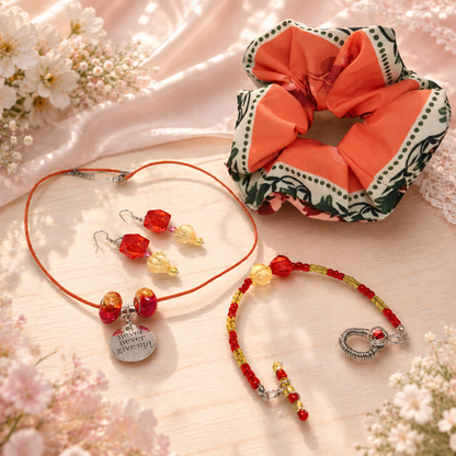 Jewelry set with necklace, bracelet, earrings, and scrunchie.