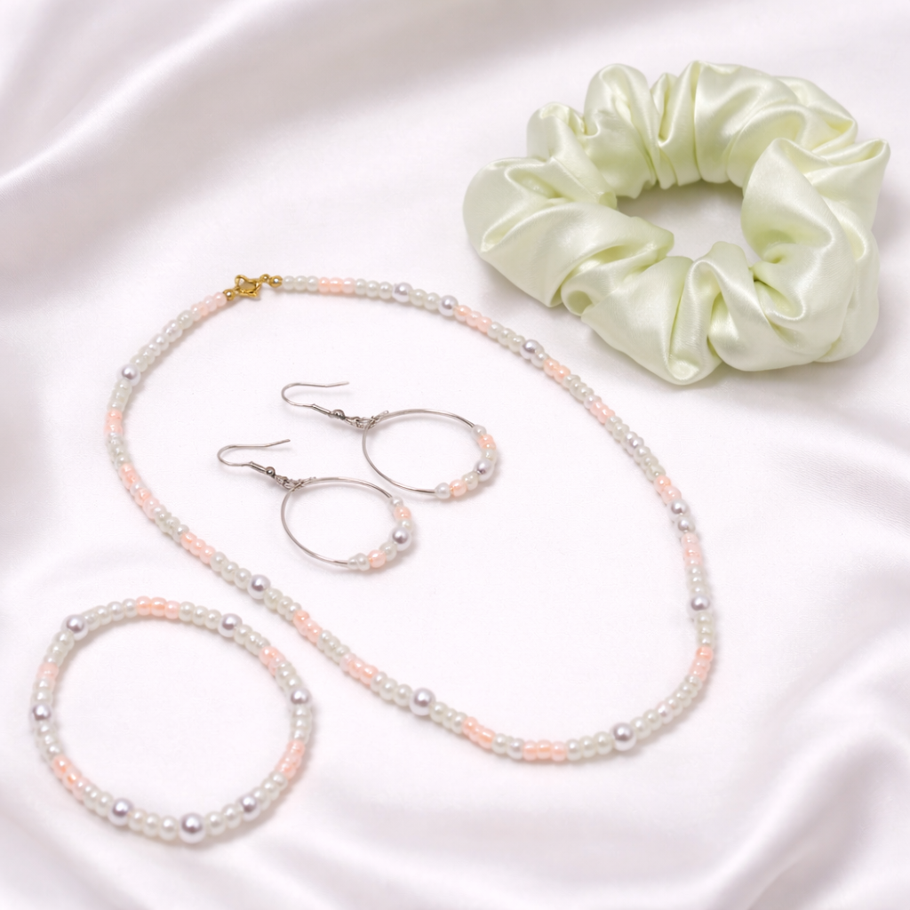 This gift set includes, multi color soft pastel beads with matching loop earrings and bracelet, and satin hair scrunchie and gift box.