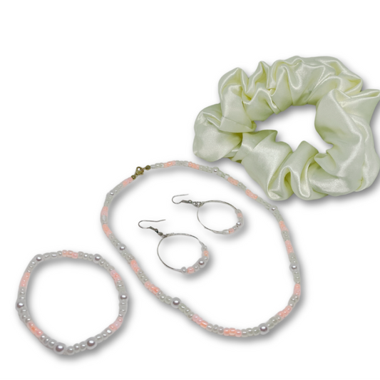 This gift set includes, multi color soft pastel beads with matching loop earrings and bracelet, and satin hair scrunchie and gift box.