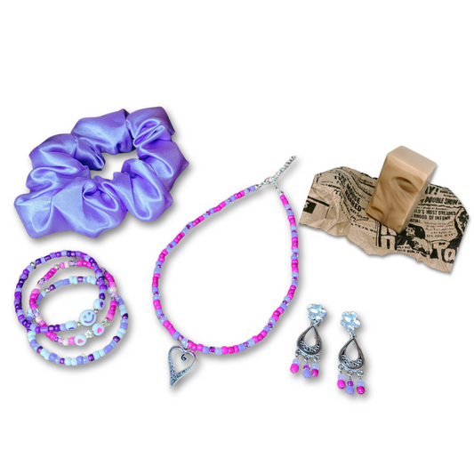 The Serene Purple Haze gift set for women featuring purple bead necklace, matching three bracelets, dangling earrings and satin hair scrunchie and a lavender mini soap. Gift bag.