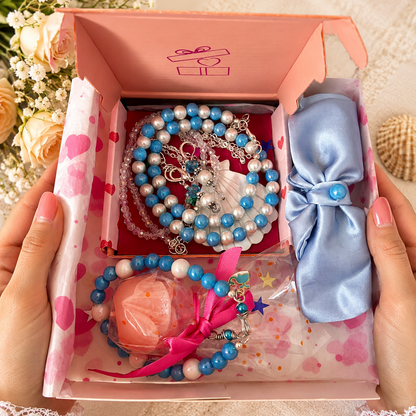 Gift box with jewelry, hair bow and free gift.