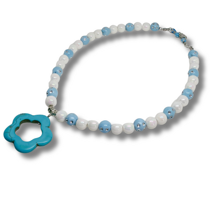 Necklace with blue and white beads with blue flower pendant