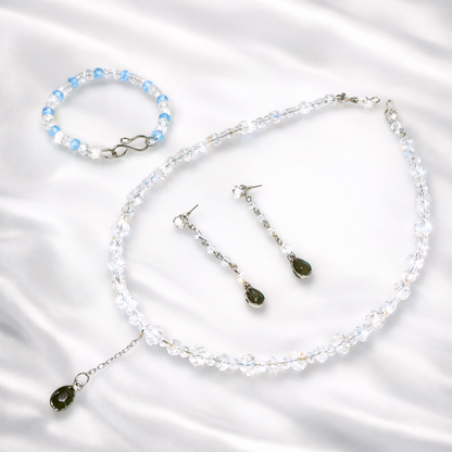Jewelry set with necklace, bracelet, and earrings.