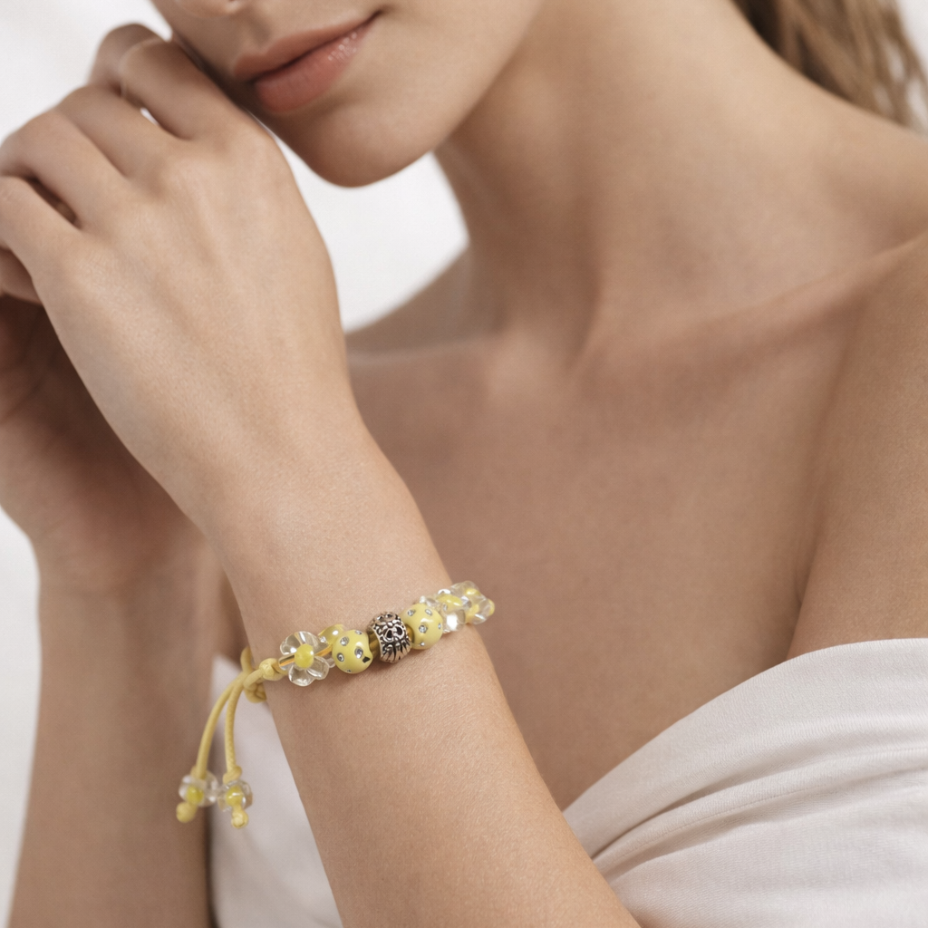 Yellow rope bracelet with glass beads and yellow beads.