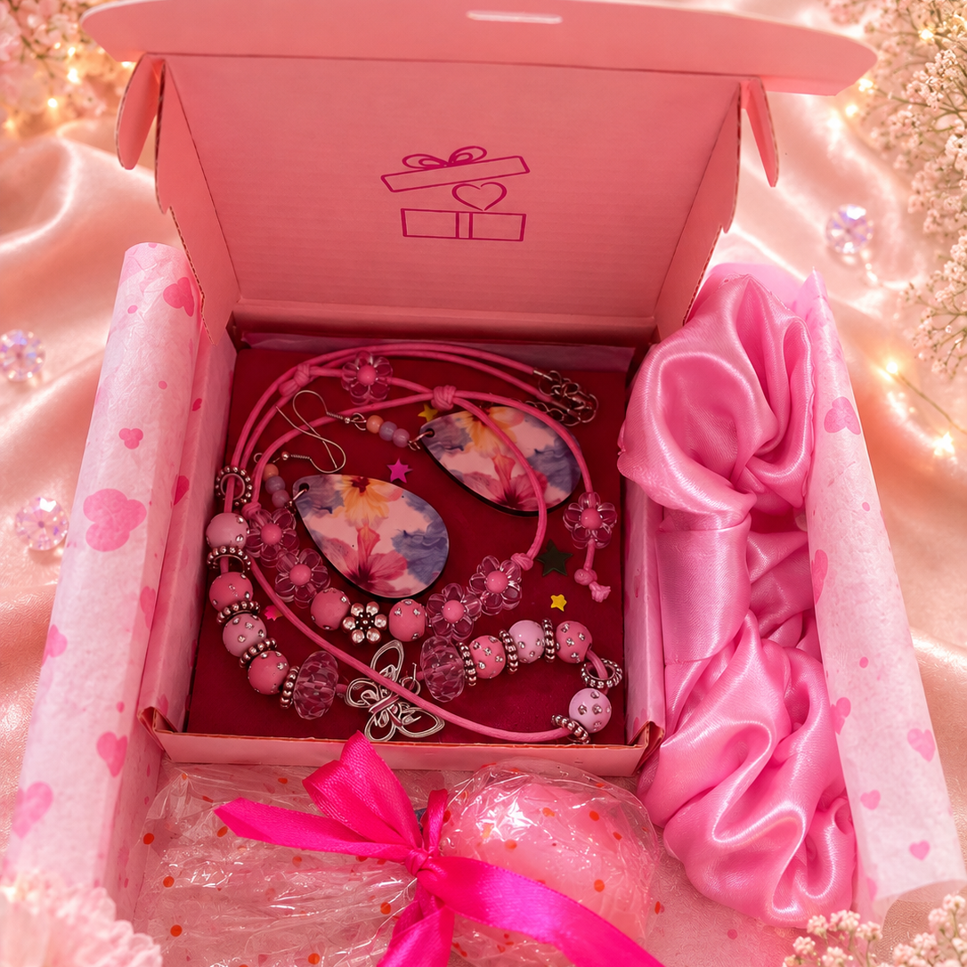Gift set includes pink necklace, matching bracelet, pink flower earrings, pink satin hair scrunchie and free gift