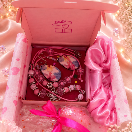 Gift set includes pink necklace, matching bracelet, pink flower earrings, pink satin hair scrunchie and free gift