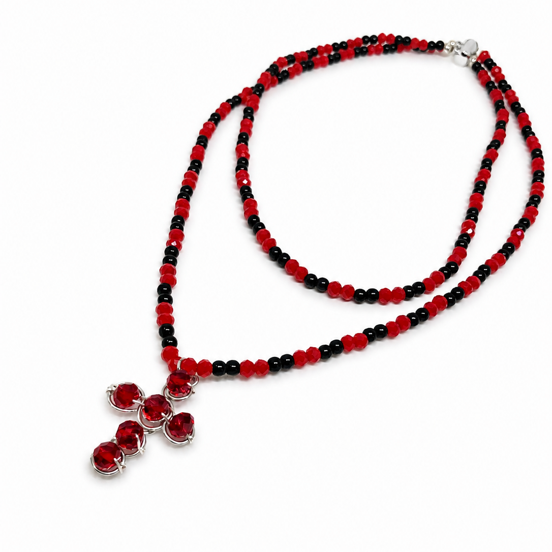Red and black beads necklace with cross pendant.