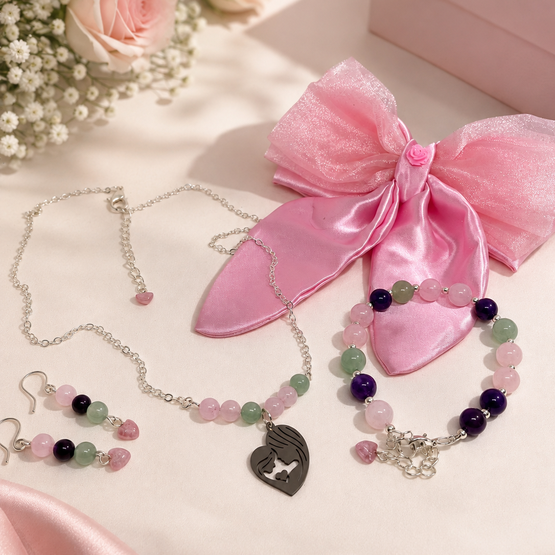 Gift set for new mum includes necklace, bracelet, earrings, pink satin hair bow and free gift.