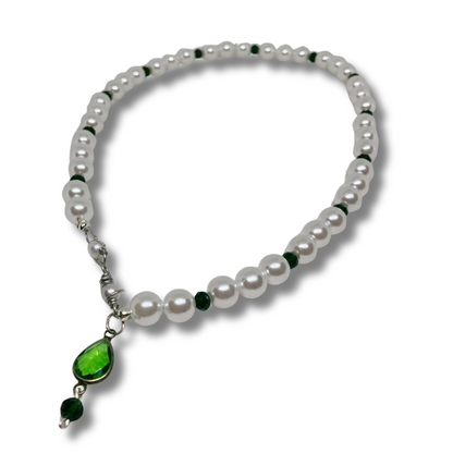 White imitation pearls necklace with green pendant.