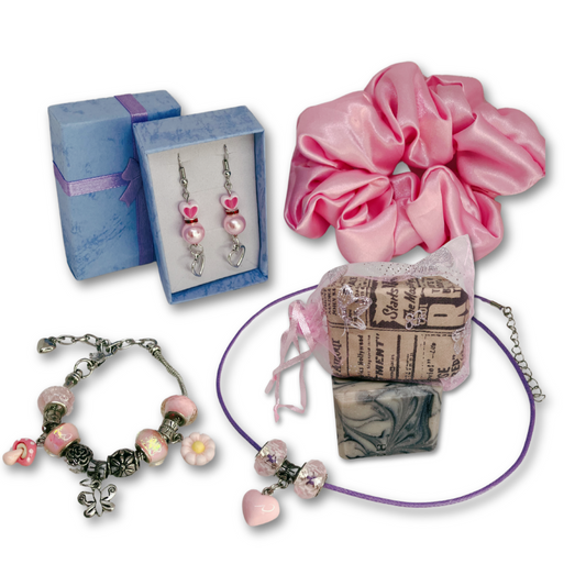 Necklace with pink heart and beads, matching bracelet with charms, dangling earrings, pink satin hair scrunchie and rose fragrance soap.