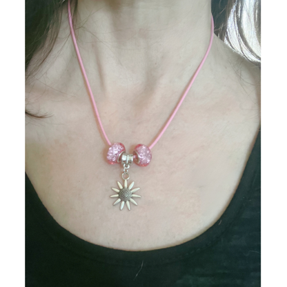 Pink cord necklace with pink glass charms and silver star.