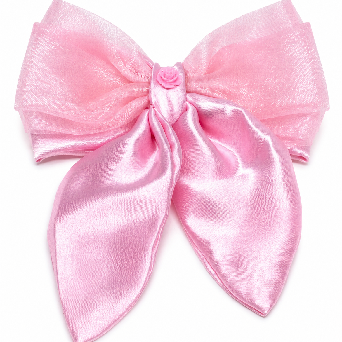 Pink hair bow made of layered sheer organza and glossy satin ribbon, featuring a small pink fabric rose at the center.
