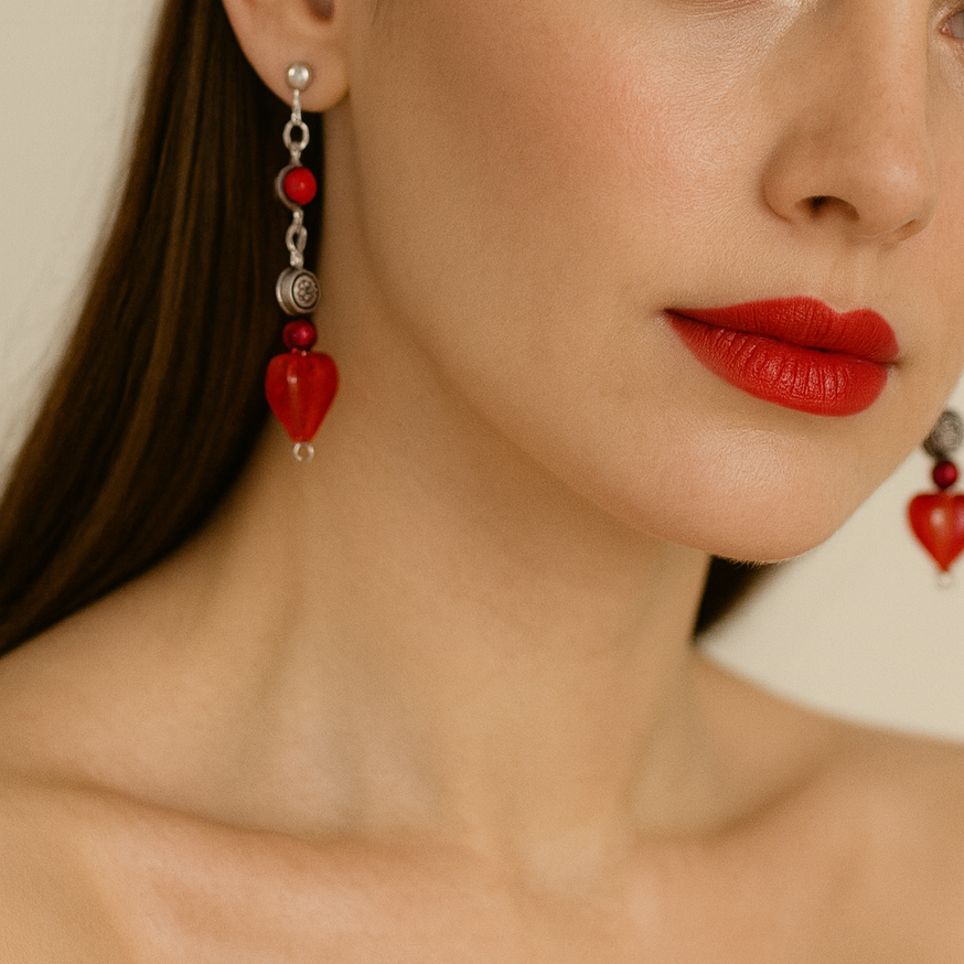 Red heart dangling earrings.