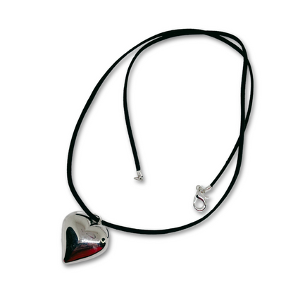Black suede cord necklace with silver heart pendant. 