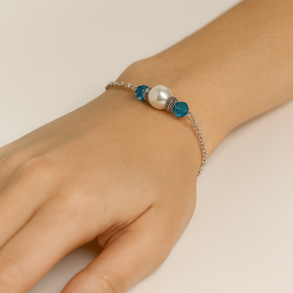 Silver bracelet with pearl and blue beads