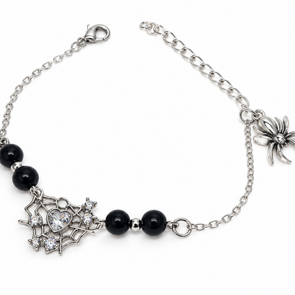 Silver bracelet with black beads and silver spiderweb