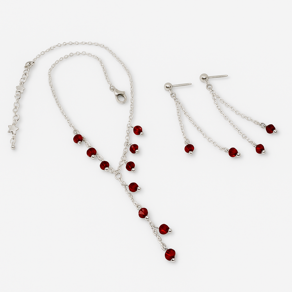 Silver necklace and earrings with red beads.