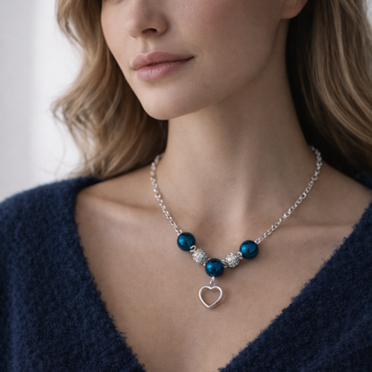 Silver necklace wit blue and silver beads with heart pendant
