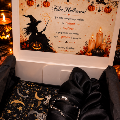 The set includes a spiderweb necklace with dangling spider charm, matching earrings, bracelet and black satin scrunchie, beautifully presented and ready to gift.