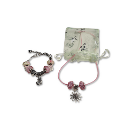 Star necklace with pink beads and matching charm bracelet gifted in an organza bag