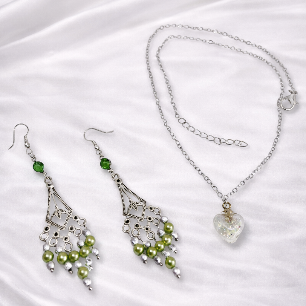 Dangling green and silver earrings and silver necklace with heart pendant