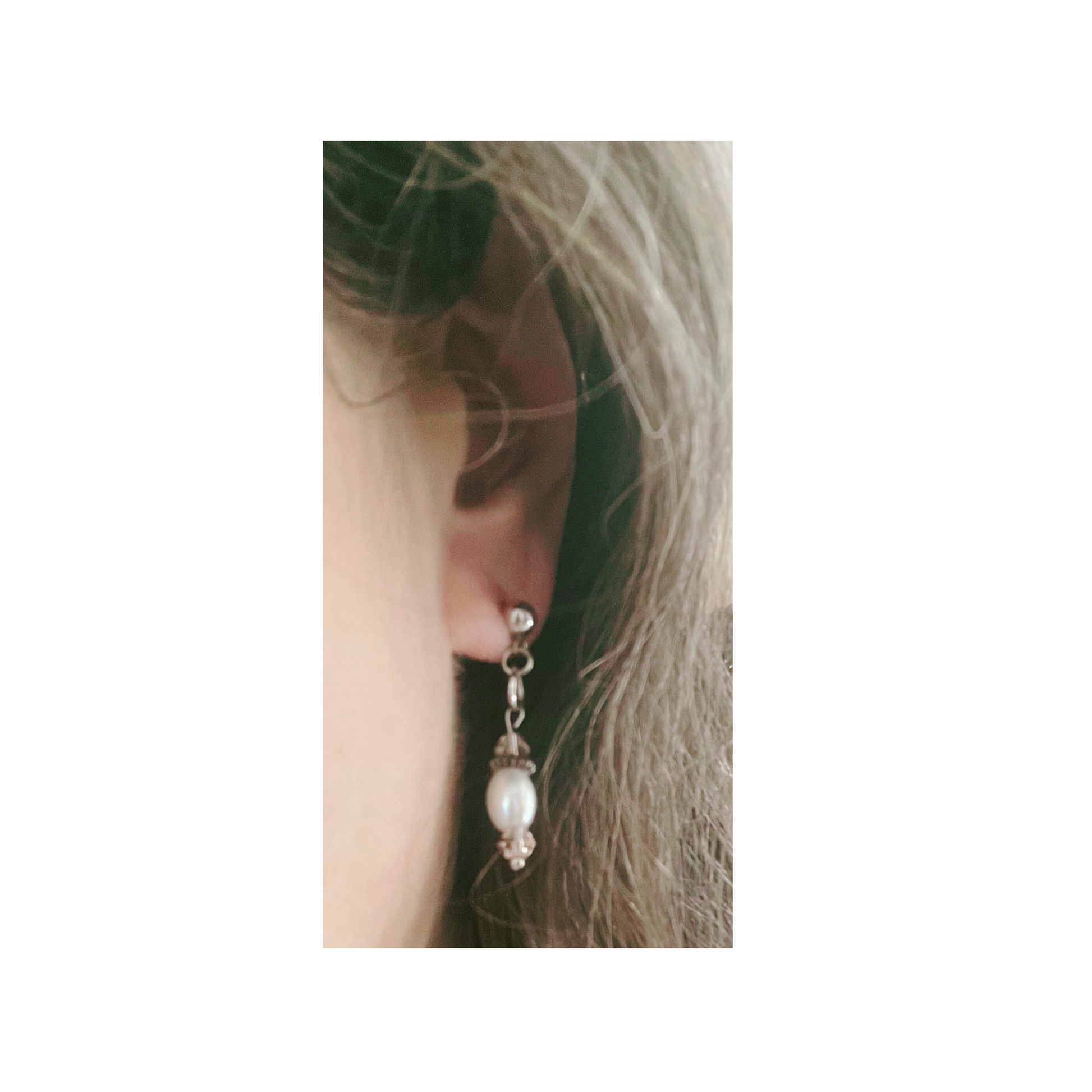 White pearl earrings with pink glass beads.