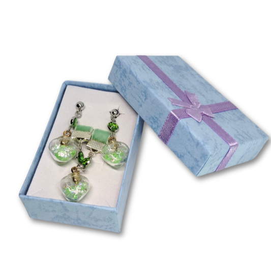 The Everyday Glow gift set for women featuring green velvet choker with heart pendant and matching earrings.