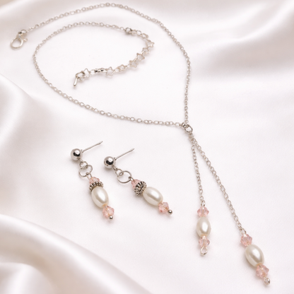 This gift set for women featuring silver necklace with white imitation pearl and pink glass beads with matching earrings.