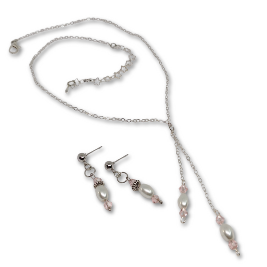 This gift set for women featuring silver necklace with white imitation pearl and pink glass beads with matching earrings.