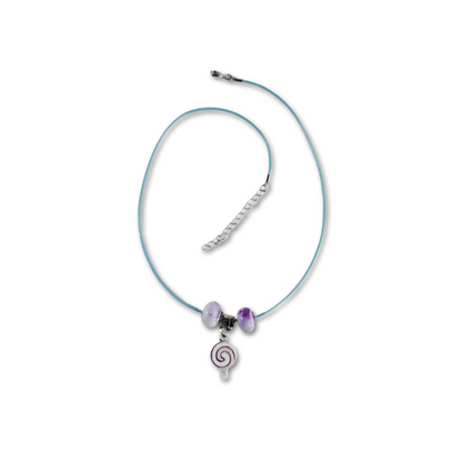 Beautiful swirling candy pendant necklace with purple beads around a blue material chain