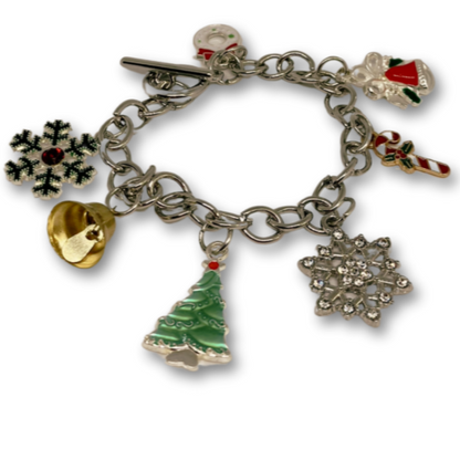 A Christmas bracelet with many charms of a Christmas tree, golden bell, snowflakes and candy.