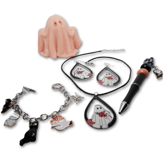 The Halloween Ghostly Glam gift set containing ghost themed earrings and a necklace together with a bracelet, pen and ghostly candle